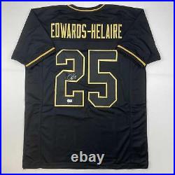 Autographed/Signed Clyde Edwards-Helaire Kansas City Blackout Football Jersey Be