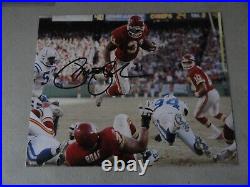 Kansas City Chiefs PRIEST HOLMES signed 8 x 10 photo LEAPING OVER THE PILE COA