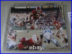 Kansas City Chiefs PRIEST HOLMES signed 8 x 10 photo LEAPING OVER THE PILE COA